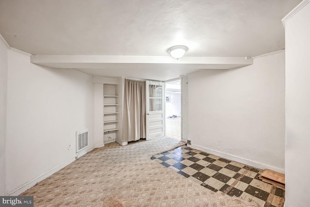 carpeted spare room with crown molding