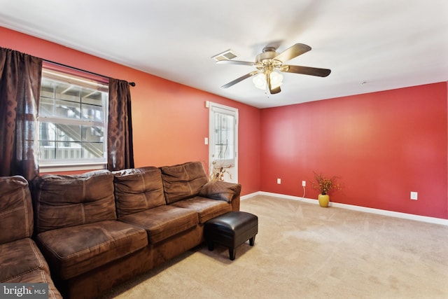 living room featuring ceiling fan and light carpet