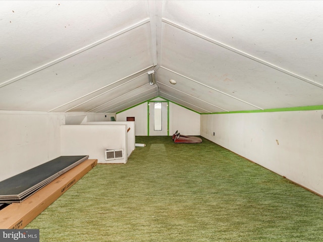 additional living space with carpet floors and vaulted ceiling