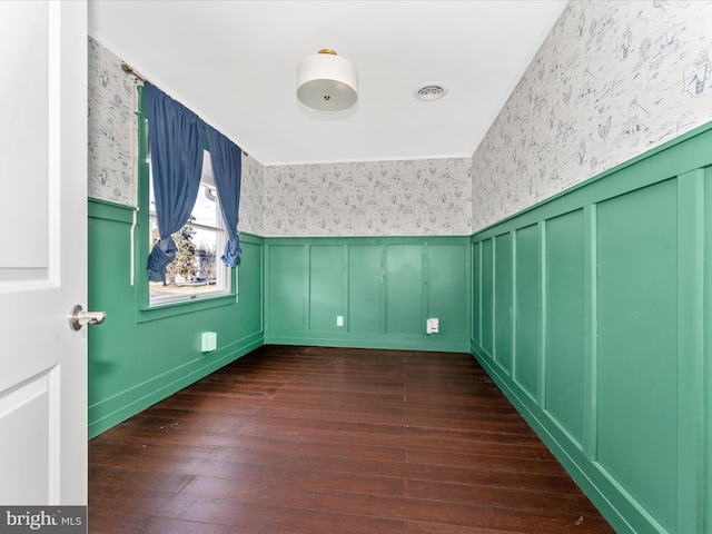 empty room featuring dark hardwood / wood-style flooring