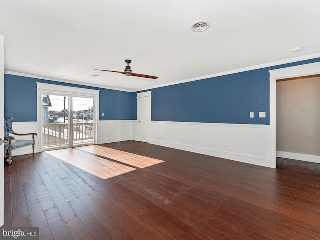 unfurnished room with dark hardwood / wood-style floors and crown molding