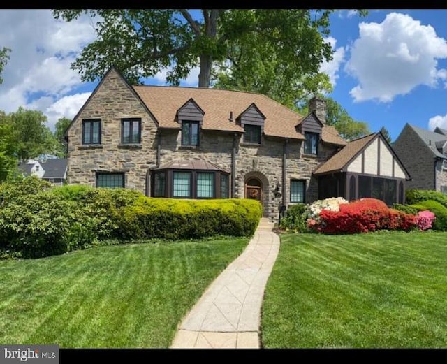 view of front of home with a front yard