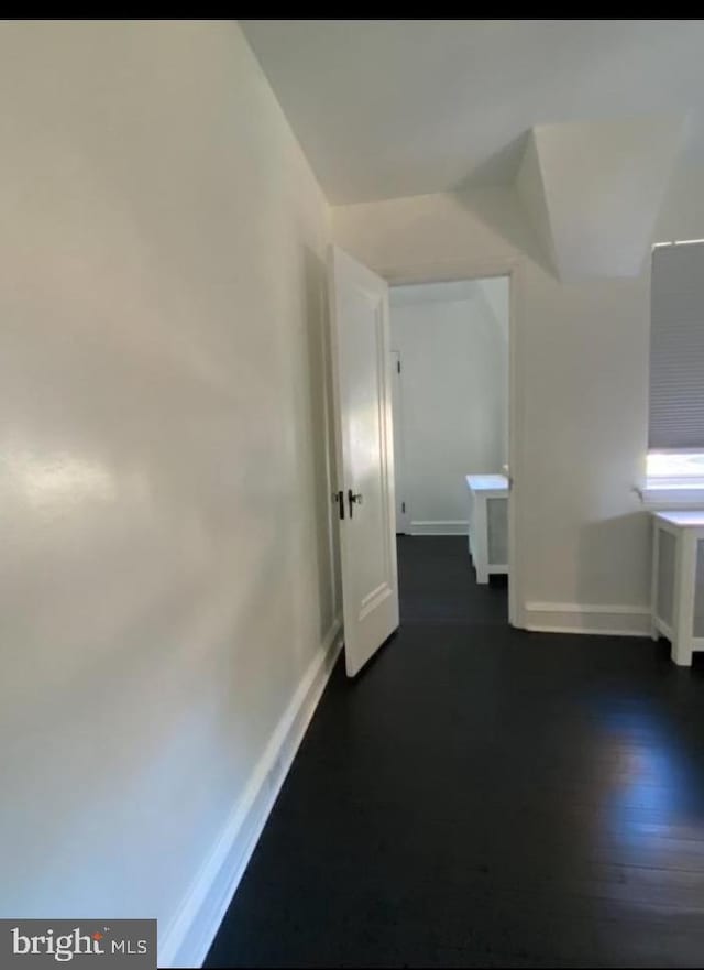 hall featuring dark wood-type flooring