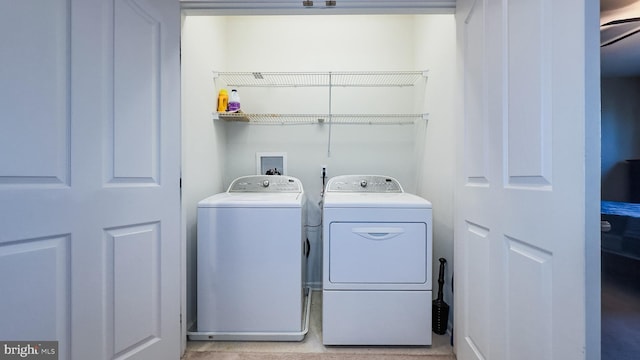 laundry room featuring washing machine and dryer