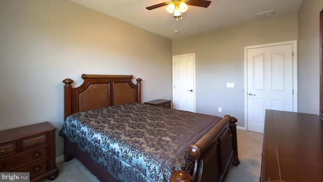 bedroom featuring ceiling fan and light colored carpet