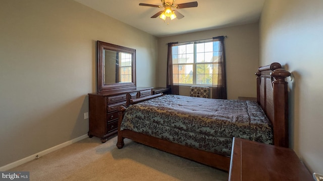 bedroom with light carpet and ceiling fan