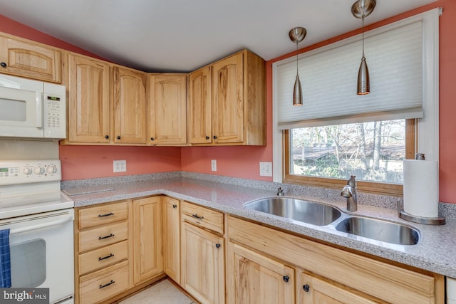 kitchen featuring sink, hanging light fixtures, white appliances, and light brown cabinets