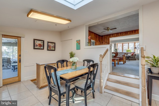 dining room with ceiling fan and light tile patterned flooring