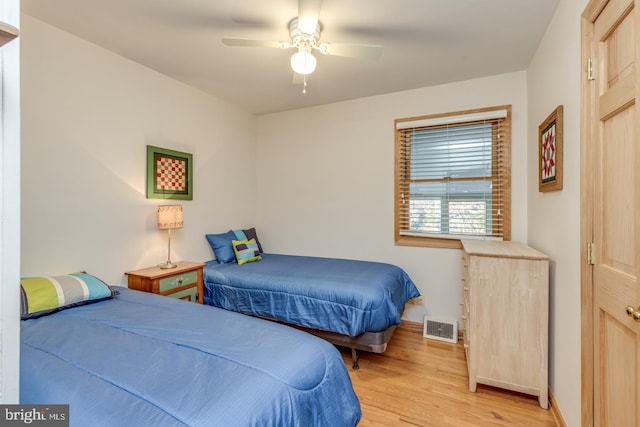 bedroom with ceiling fan and light hardwood / wood-style flooring