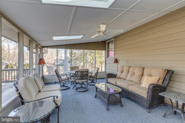 sunroom / solarium with ceiling fan and vaulted ceiling