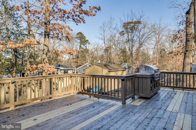 wooden deck featuring grilling area