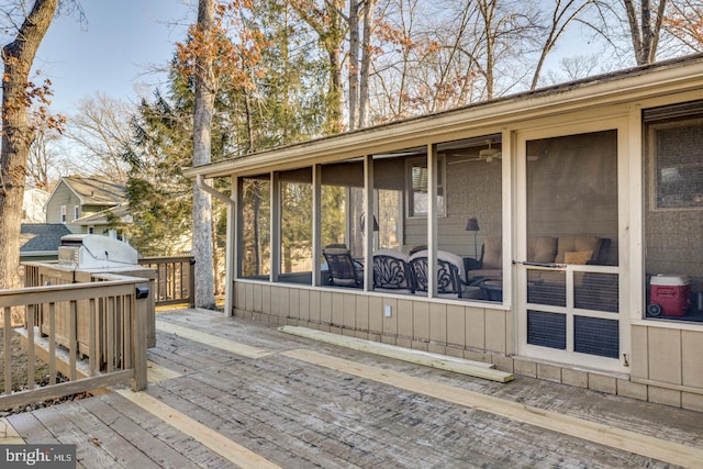 deck with a sunroom