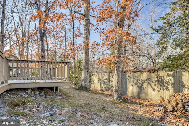 view of yard featuring a wooden deck