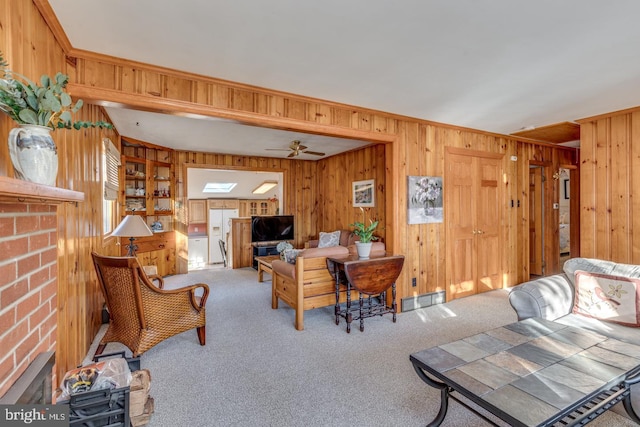 living room with carpet floors and ceiling fan