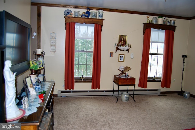 interior space with a baseboard heating unit, a healthy amount of sunlight, and carpet flooring