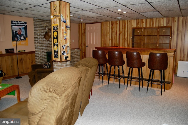 bar with carpet floors and wooden walls