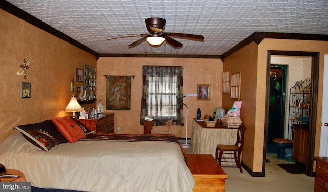 carpeted bedroom featuring ceiling fan and ornamental molding