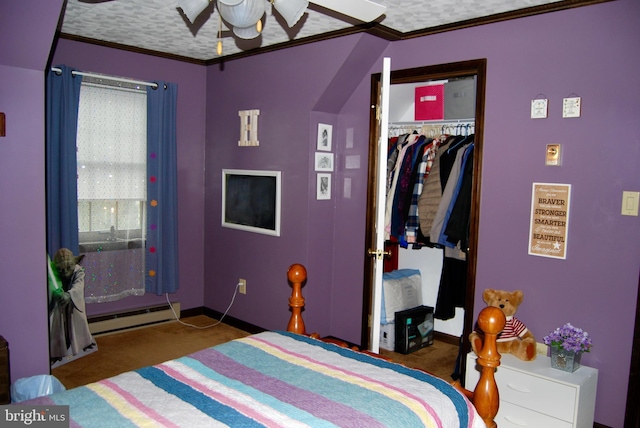 bedroom featuring ceiling fan, baseboard heating, carpet, ornamental molding, and a closet