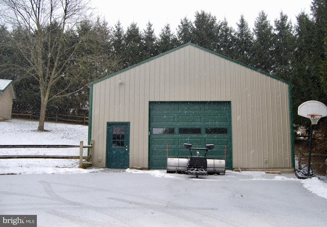 view of snow covered garage