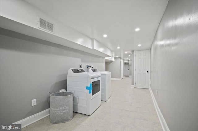 laundry area with washing machine and clothes dryer