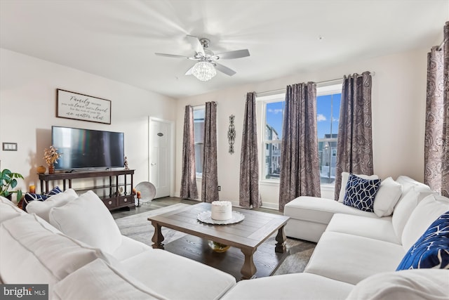 living room featuring ceiling fan and wood-type flooring