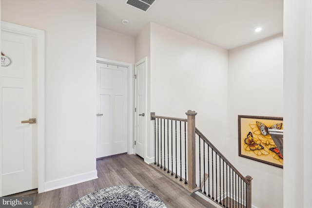 hall with hardwood / wood-style floors