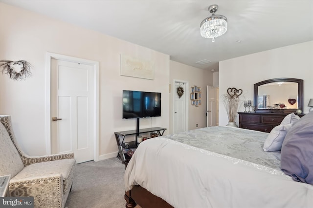 bedroom featuring light colored carpet