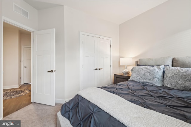 carpeted bedroom with a closet