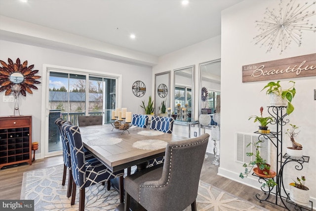 dining area featuring hardwood / wood-style floors