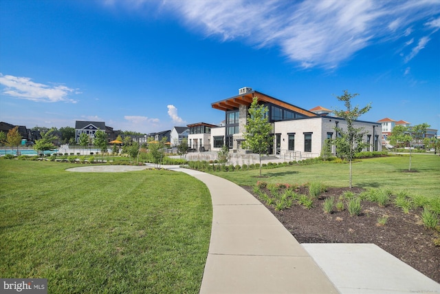 view of home's community with a lawn