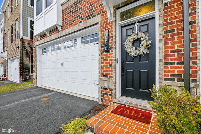 doorway to property featuring a garage