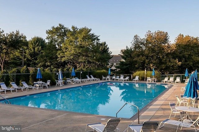 view of swimming pool with a patio area