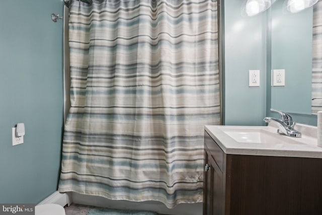 bathroom with vanity and shower / bathtub combination with curtain