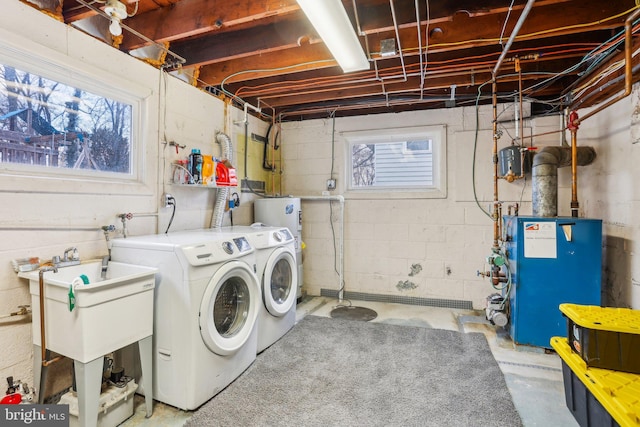 washroom featuring washer and clothes dryer and sink