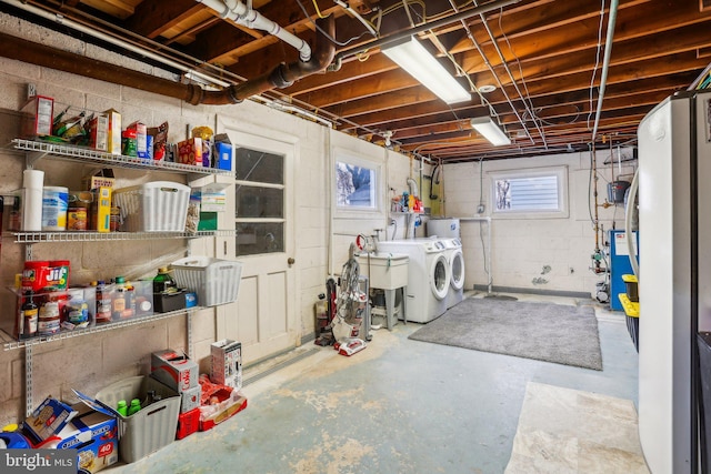 basement with washing machine and clothes dryer