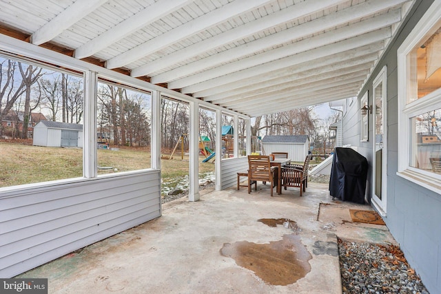 sunroom with beamed ceiling