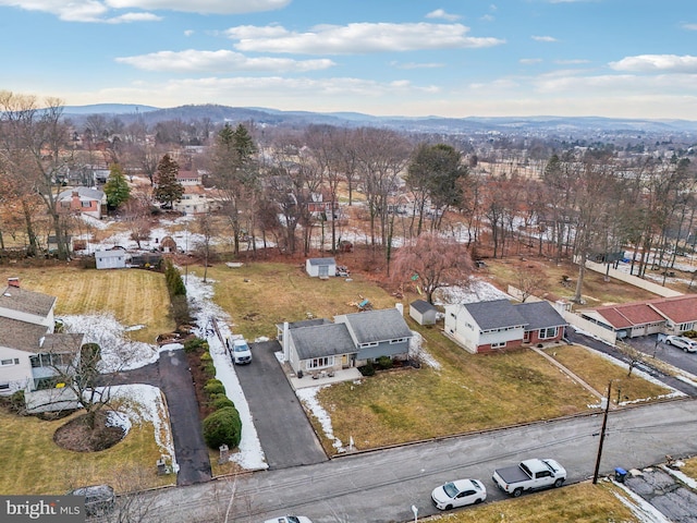 birds eye view of property featuring a mountain view