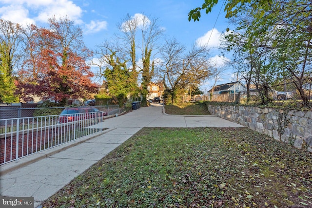 view of yard with a fenced in pool