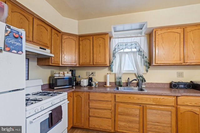 kitchen with sink and white appliances