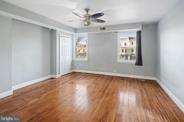 spare room featuring ceiling fan and hardwood / wood-style floors