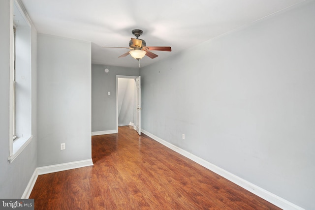 empty room featuring ceiling fan and hardwood / wood-style flooring