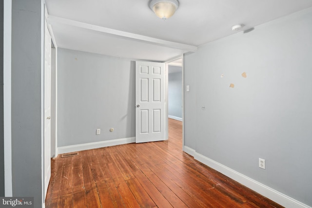 spare room with hardwood / wood-style flooring