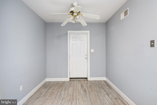 empty room featuring ceiling fan and light hardwood / wood-style floors