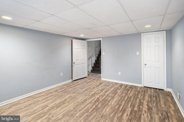 basement with dark hardwood / wood-style flooring