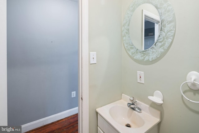 bathroom featuring hardwood / wood-style flooring and vanity