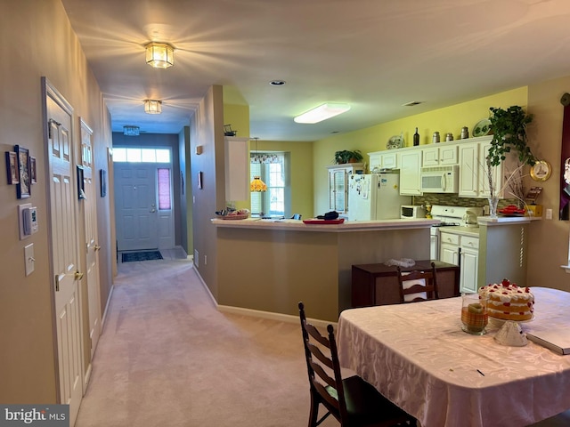 view of carpeted dining space