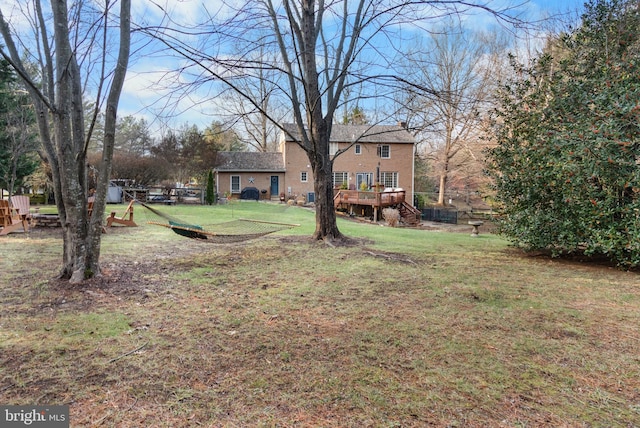 view of yard featuring a wooden deck