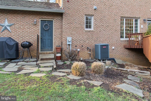 doorway to property featuring central AC unit