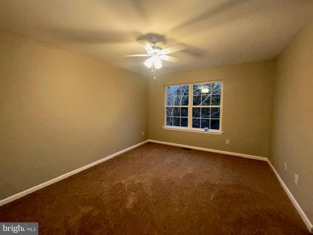 empty room featuring ceiling fan and carpet flooring