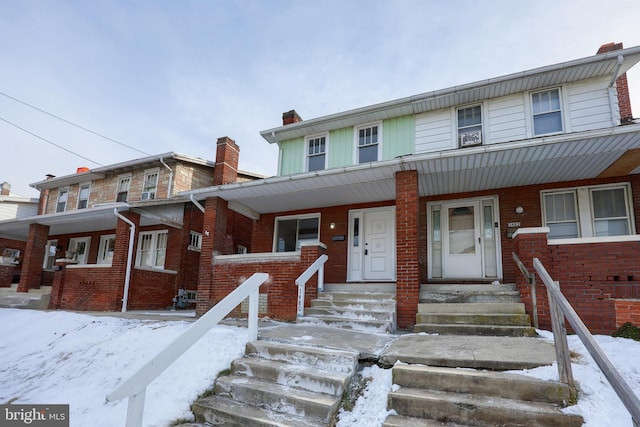 multi unit property featuring a porch